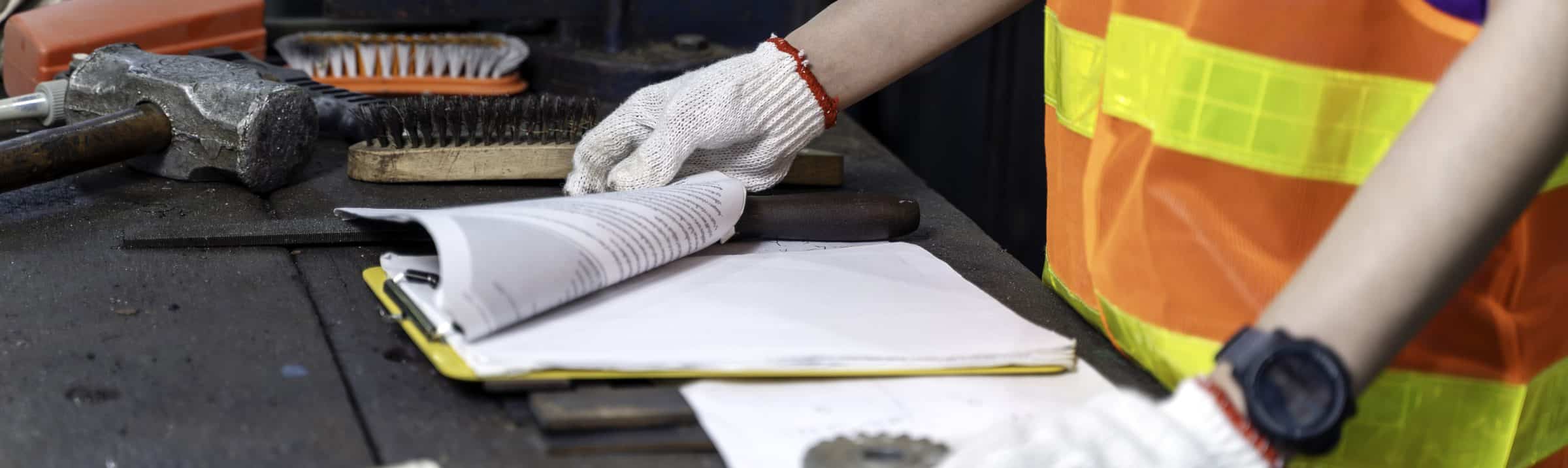 Closeup of an engineer technician with a clipboard