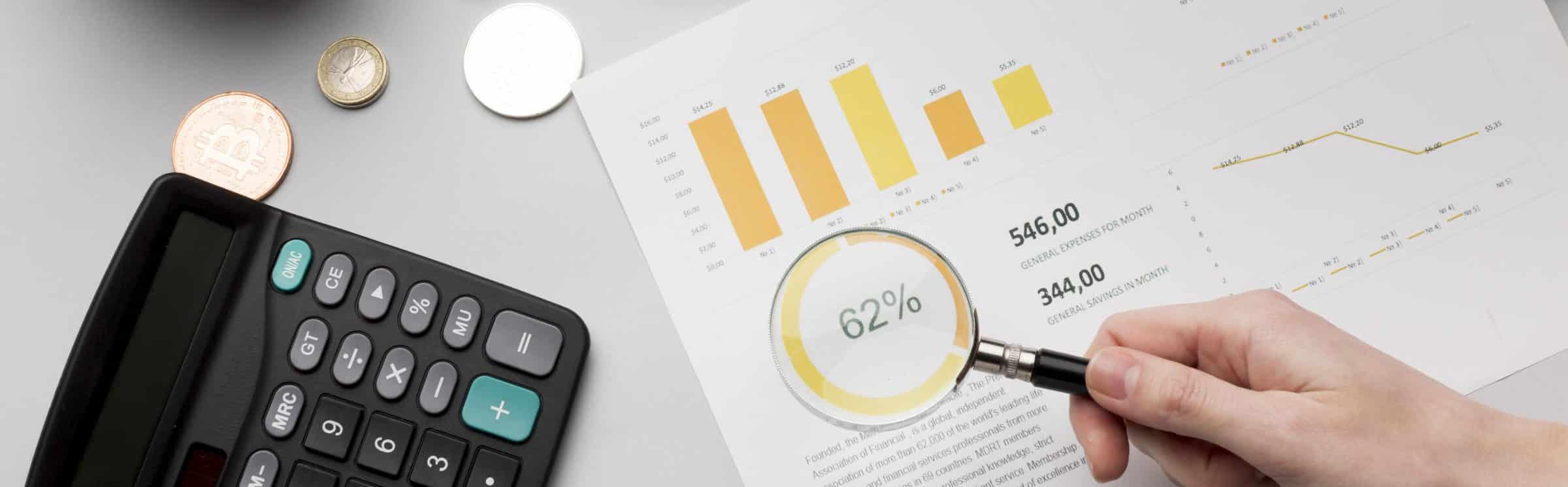 Concept of an economics report with magnifying glass